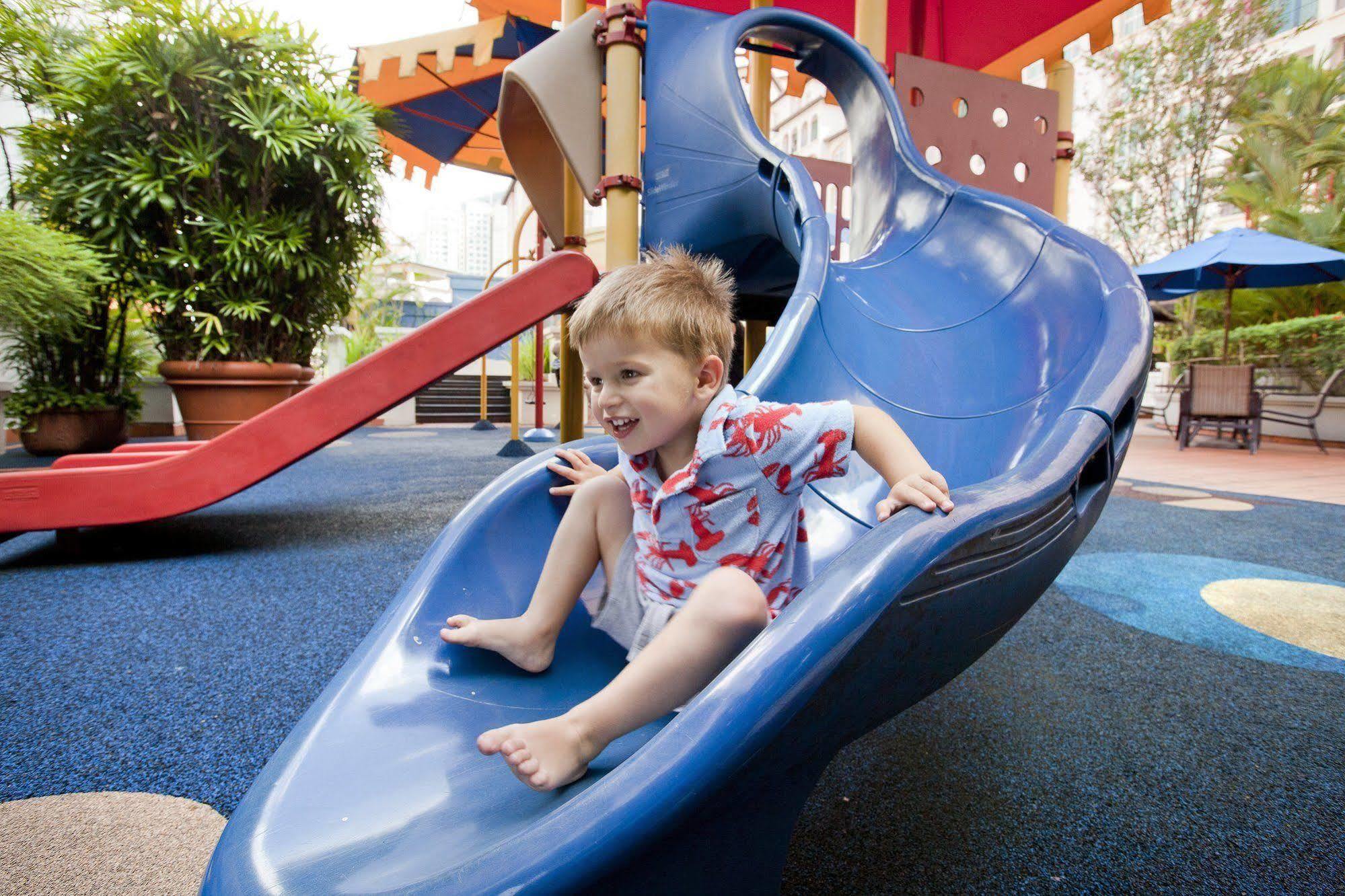 Fraser Place Robertson Walk Singapore Buitenkant foto A child on a slide